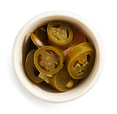 Extra pickled jalapeno side in a dish